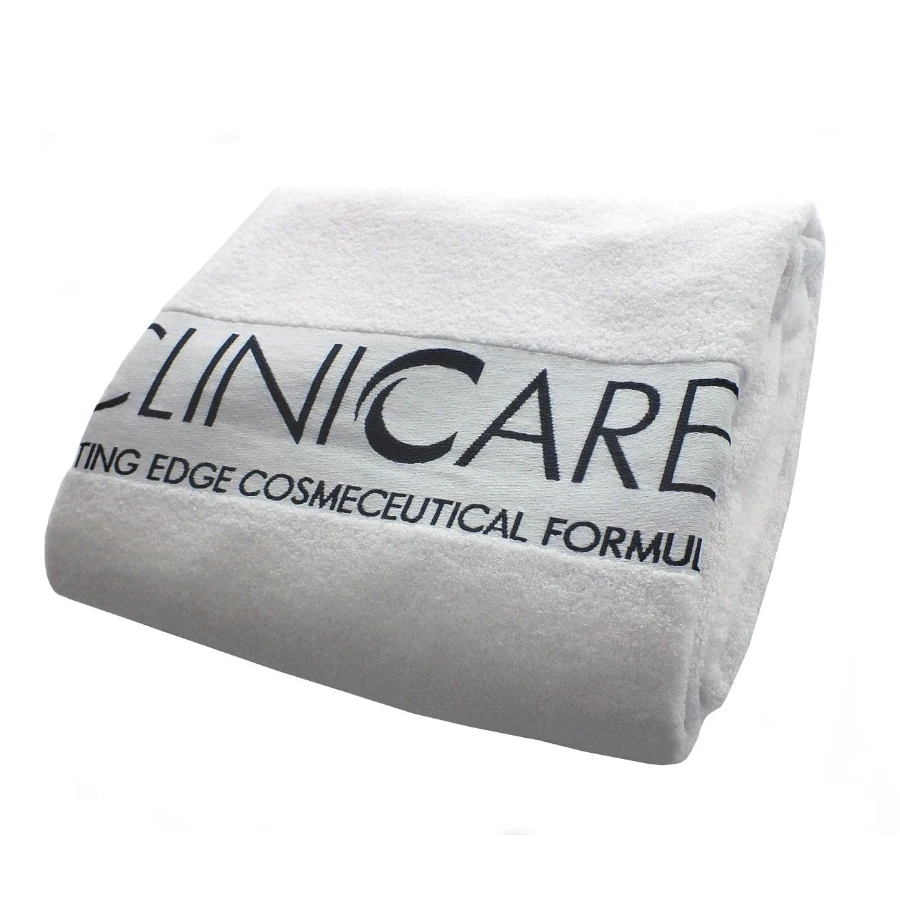 CLINICCARE Baltas frotinis rankšluostis su logotipu, 100 × 150 cm